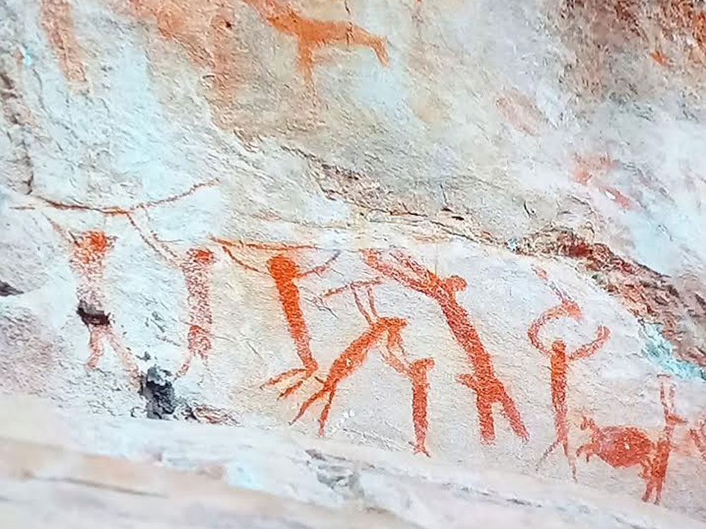 Dessin préhistorique illustrant des personnes, hommes et enfants